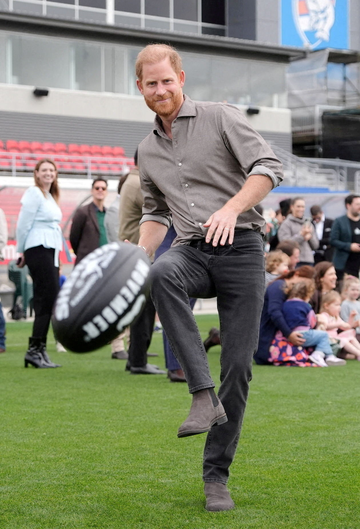 Prince Harry kicks a Sherrin ball during a Western Bulldogs Australian rules football session, during a visit to Movember at the Western Bulldogs HQ at Mission Whitten Oval, in Footscray, Melbourne.