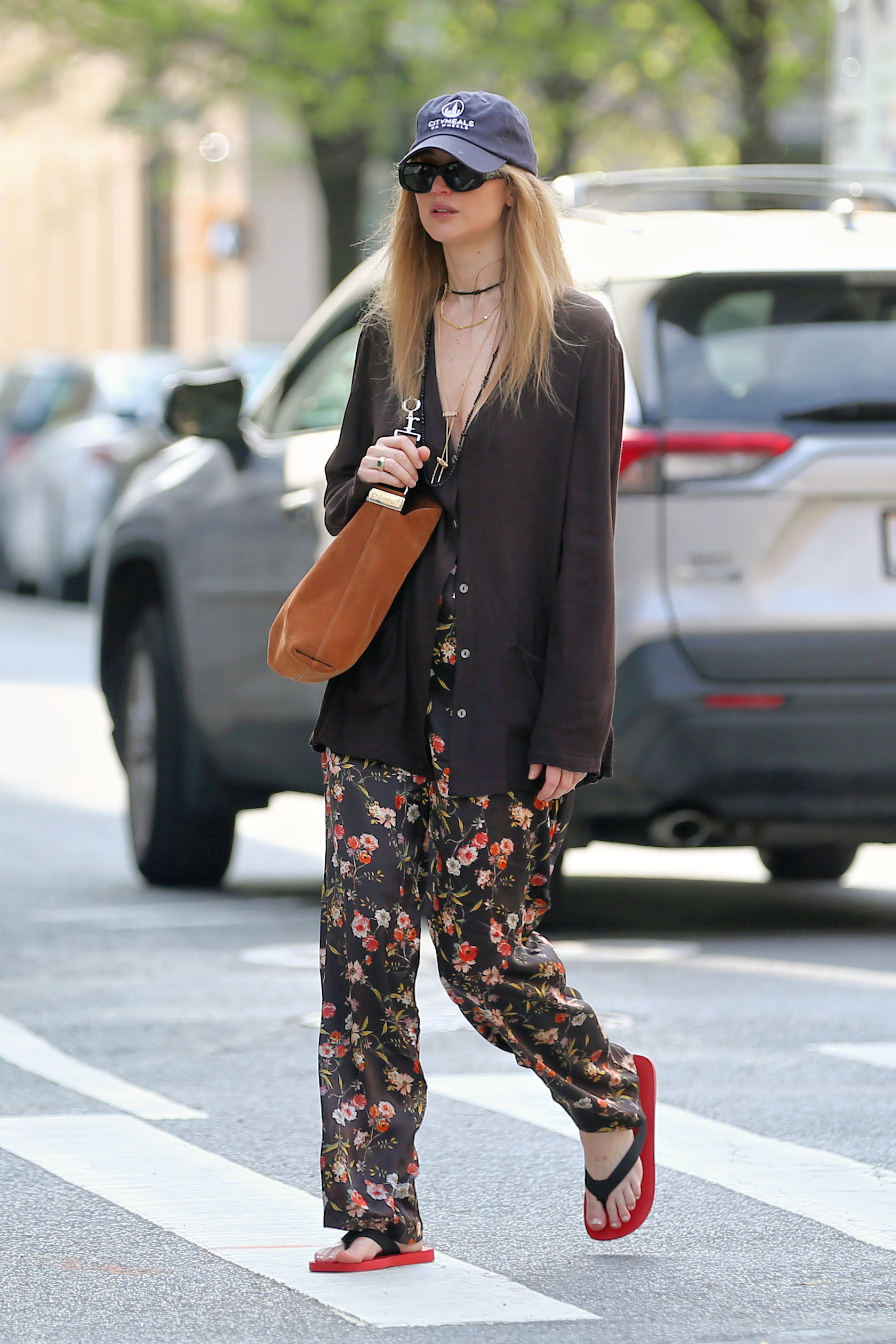 Jennifer Lawrence keeps it casual in The Row Dune Scarlett platform flip flops while out and about in NYC.