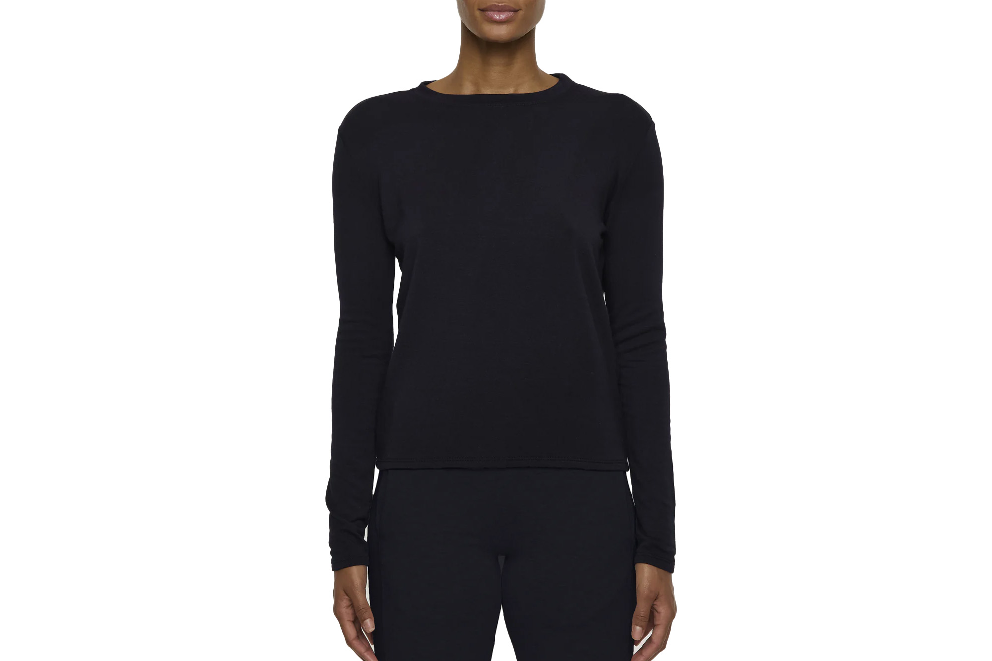 A person modeling a navy long-sleeved shirt.