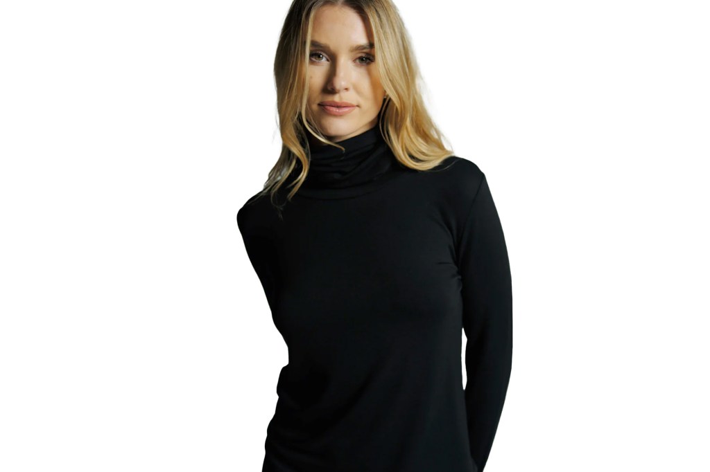 A woman in a black turtleneck shirt.