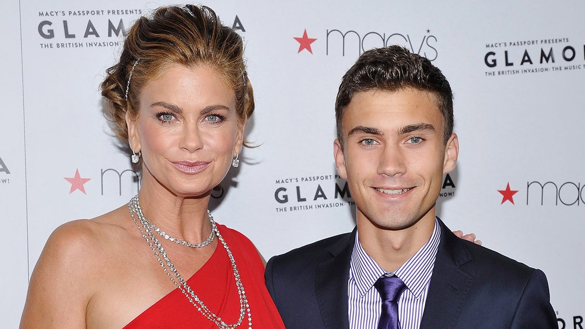 Kathy Ireland walks red carpet with son Erik Olsen