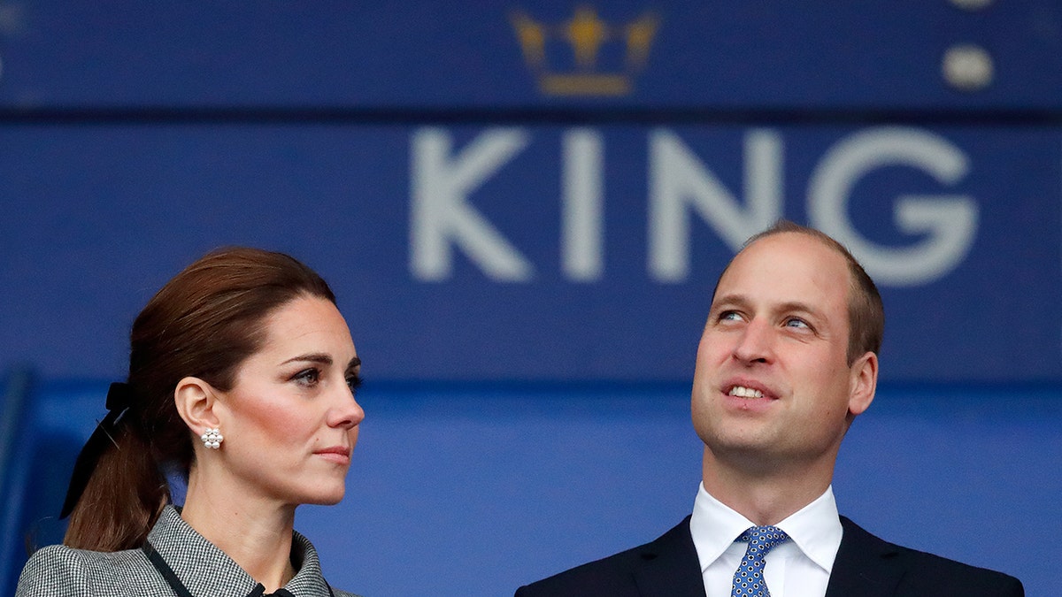 Catherine Duchess of Cambridge and Prince William Duke of Cambridge standing at King Power Stadium