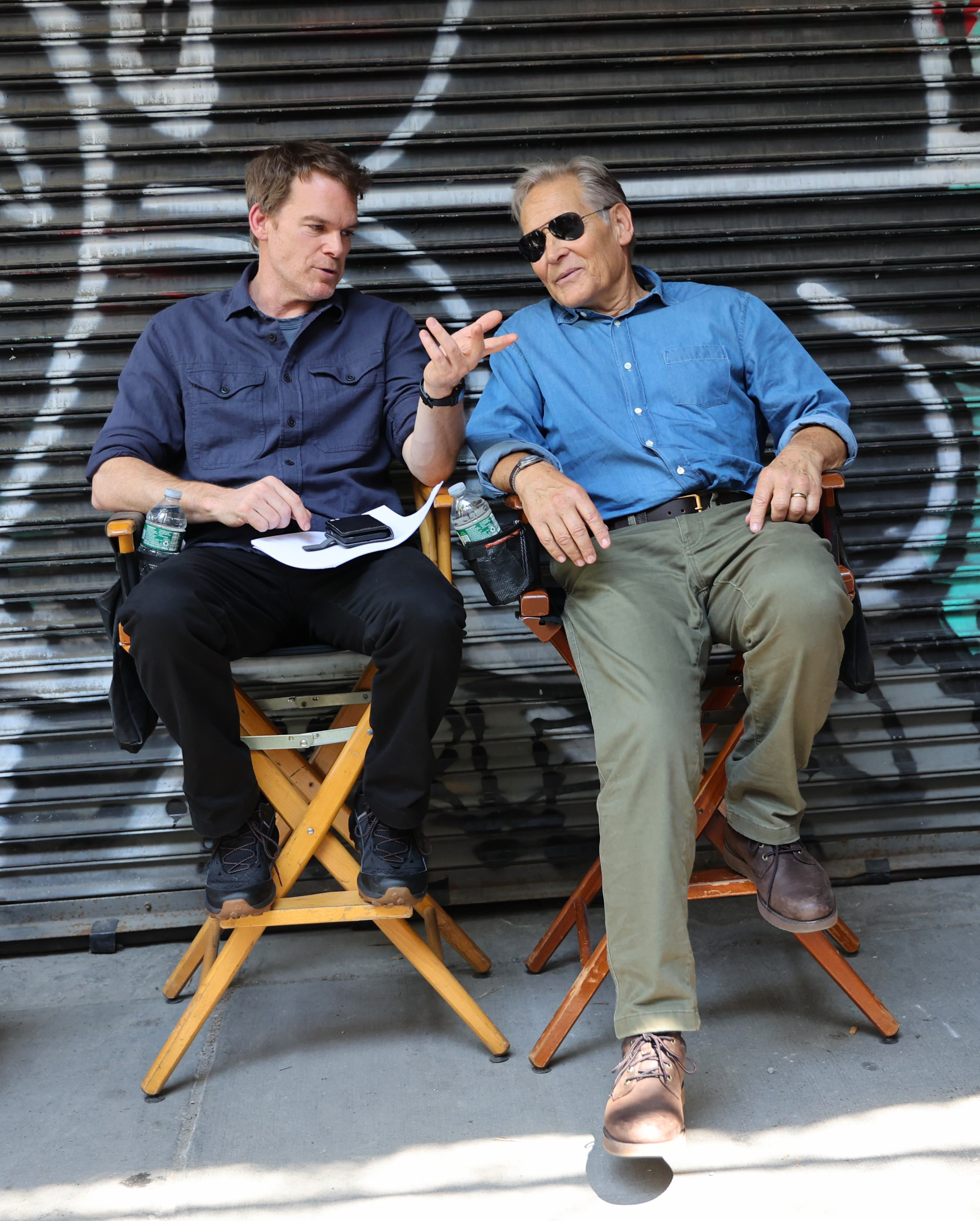 Michael C. Hall (left) and James Remar take a break while filming “Dexter: Resurrection” in downtown Manhattan.