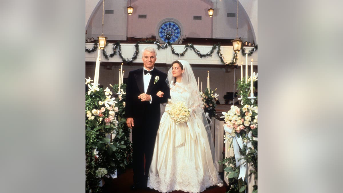 Steve Martin walking down the aisle with Kimberly Williams-Paisley in a wedding scene