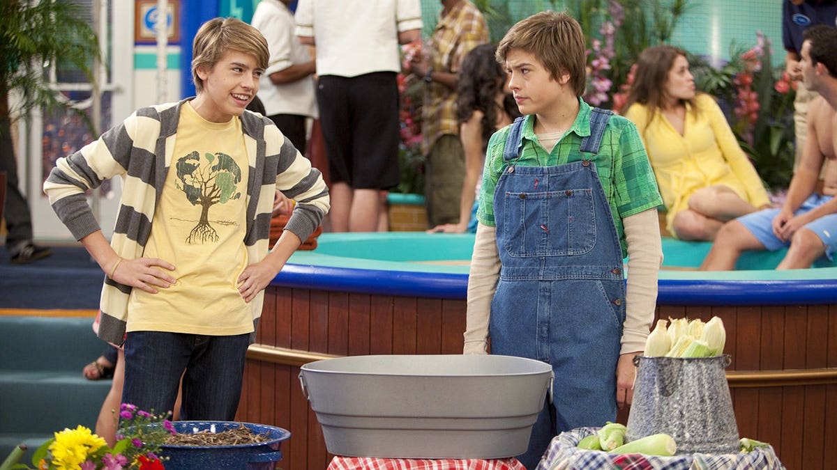 Cole and Dylan Sprouse filming a scene for "The Suite Life on Deck" season 2 in July.
