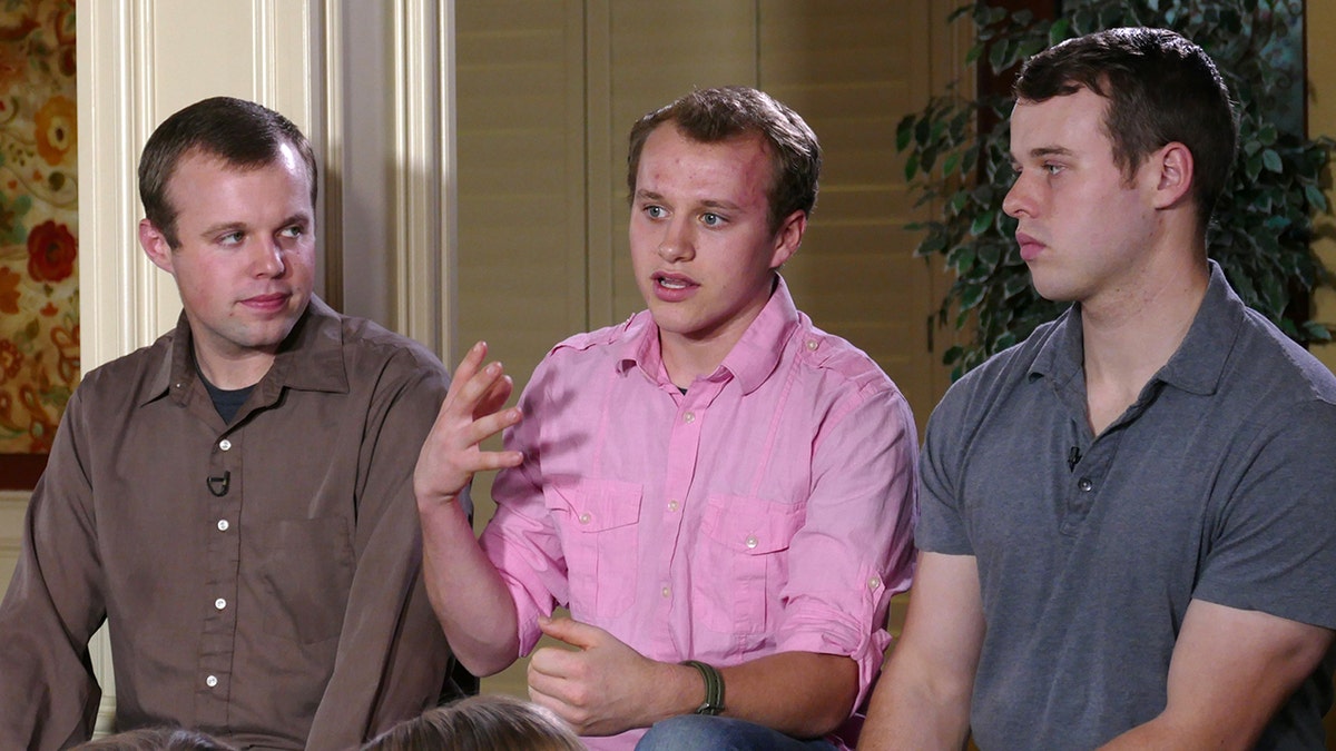 John David Duggar Josiah Duggar Joseph Duggar sitting together in Arkansas home