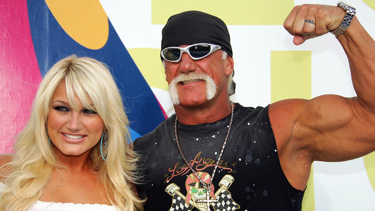 Wrestler Hulk Hogan and daughter Brooke Hogan posing on red carpet at MTV Video Music Awards