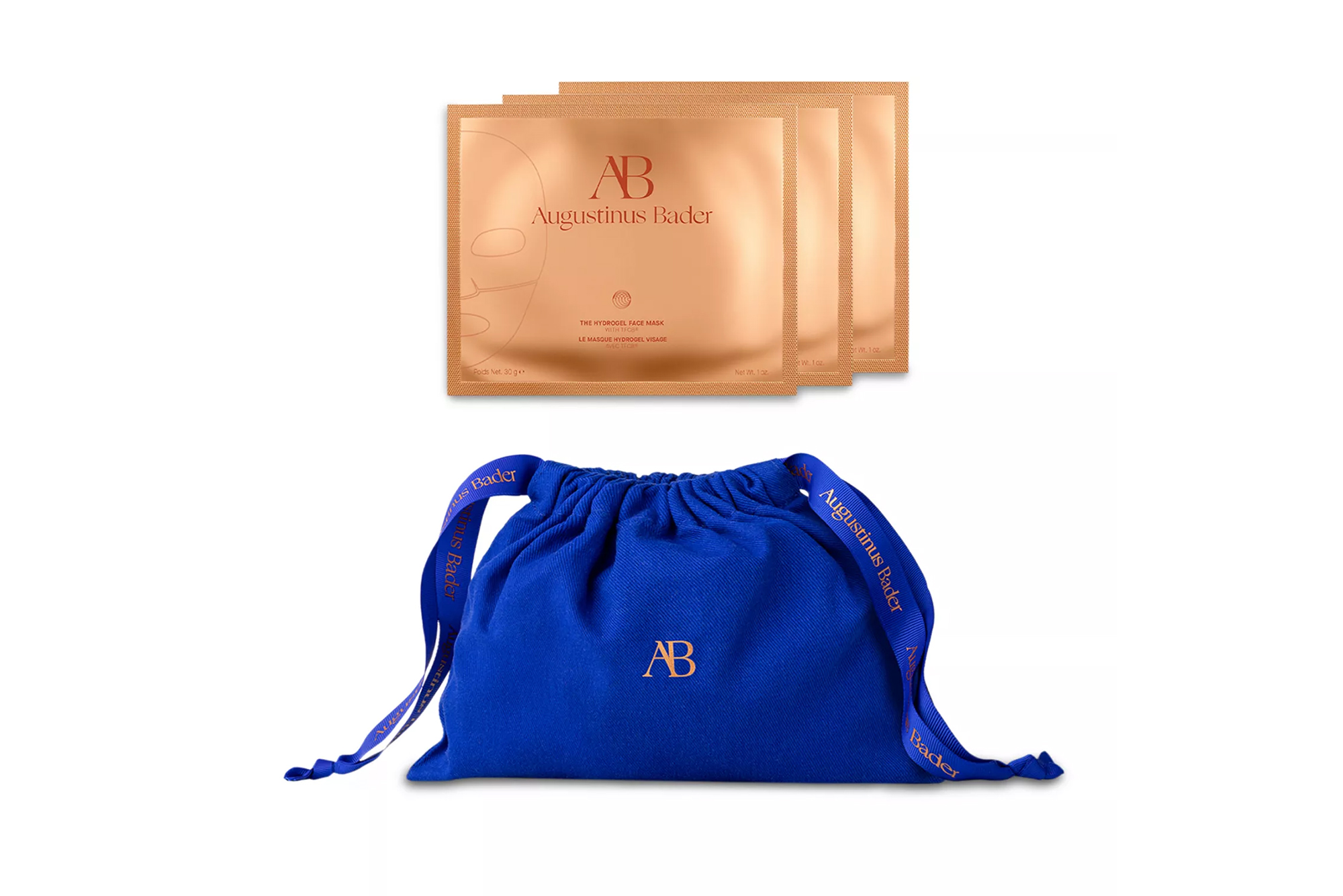 Augustinus Bader hydrogel face masks in rose gold packaging, with a blue drawstring bag.