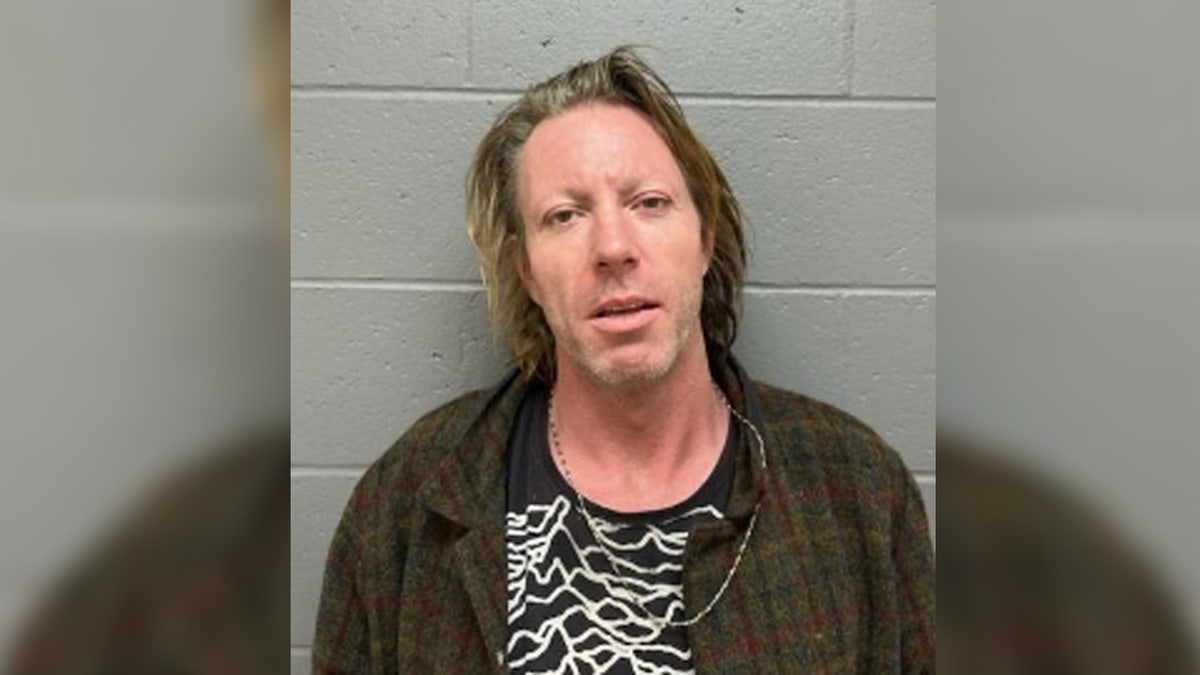 Elijah Blue Allman posing for a mugshot photo