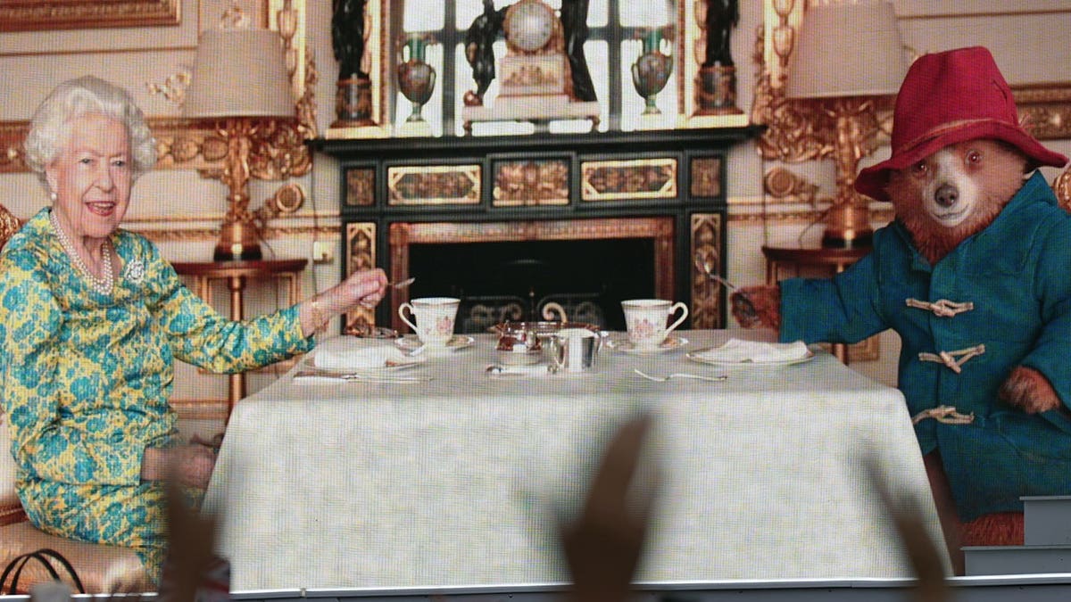 Queen Elizabeth II having tea with Paddington bear on her Platinum Jubilee in June 2022.