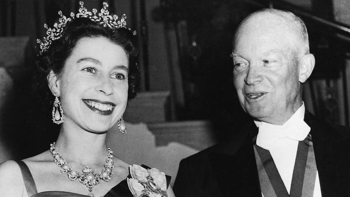 Queen Elizabeth II and President Eisenhower standing outside the White House in Washington, D.C.