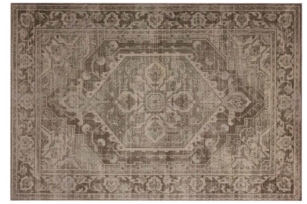 Brown and beige rug with an ornate traditional pattern.