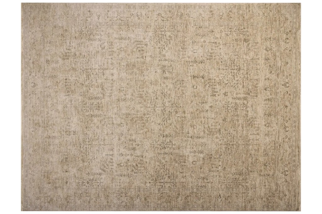 Tan and beige faded patterned rug.