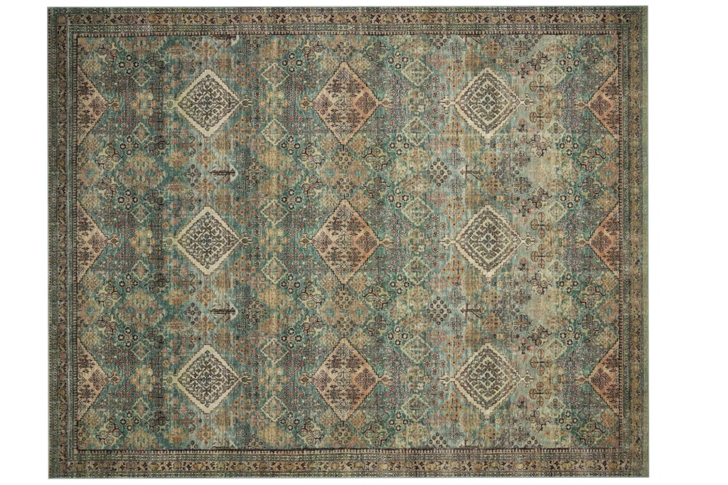 Distressed teal and brown rug with an ornate diamond pattern.