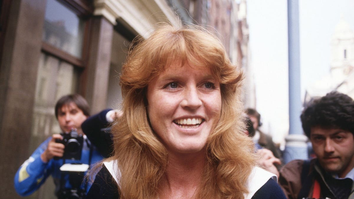 Sarah Ferguson surrounded by press photographers arriving in Mayfair London.