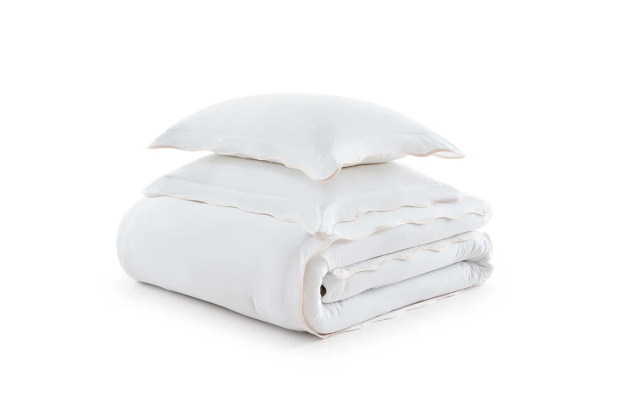 White folded duvet with a pillow on top.