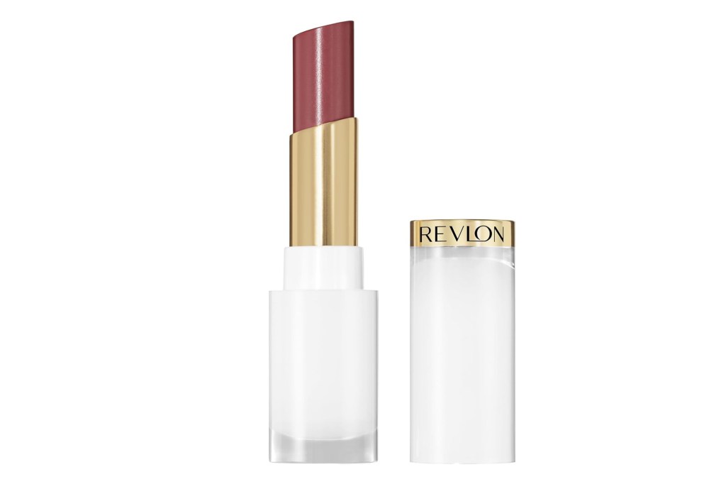 A Revlon lipstick in a shade of plum, with the cap off to the right.