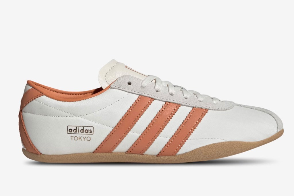 White and orange Adidas Tokyo sneaker with "adidas TOKYO" printed on the side.