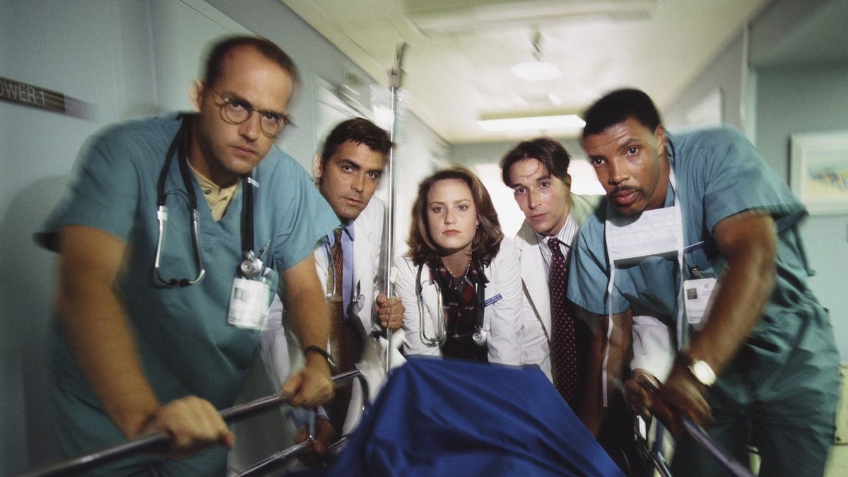 The cast of ER films a scene