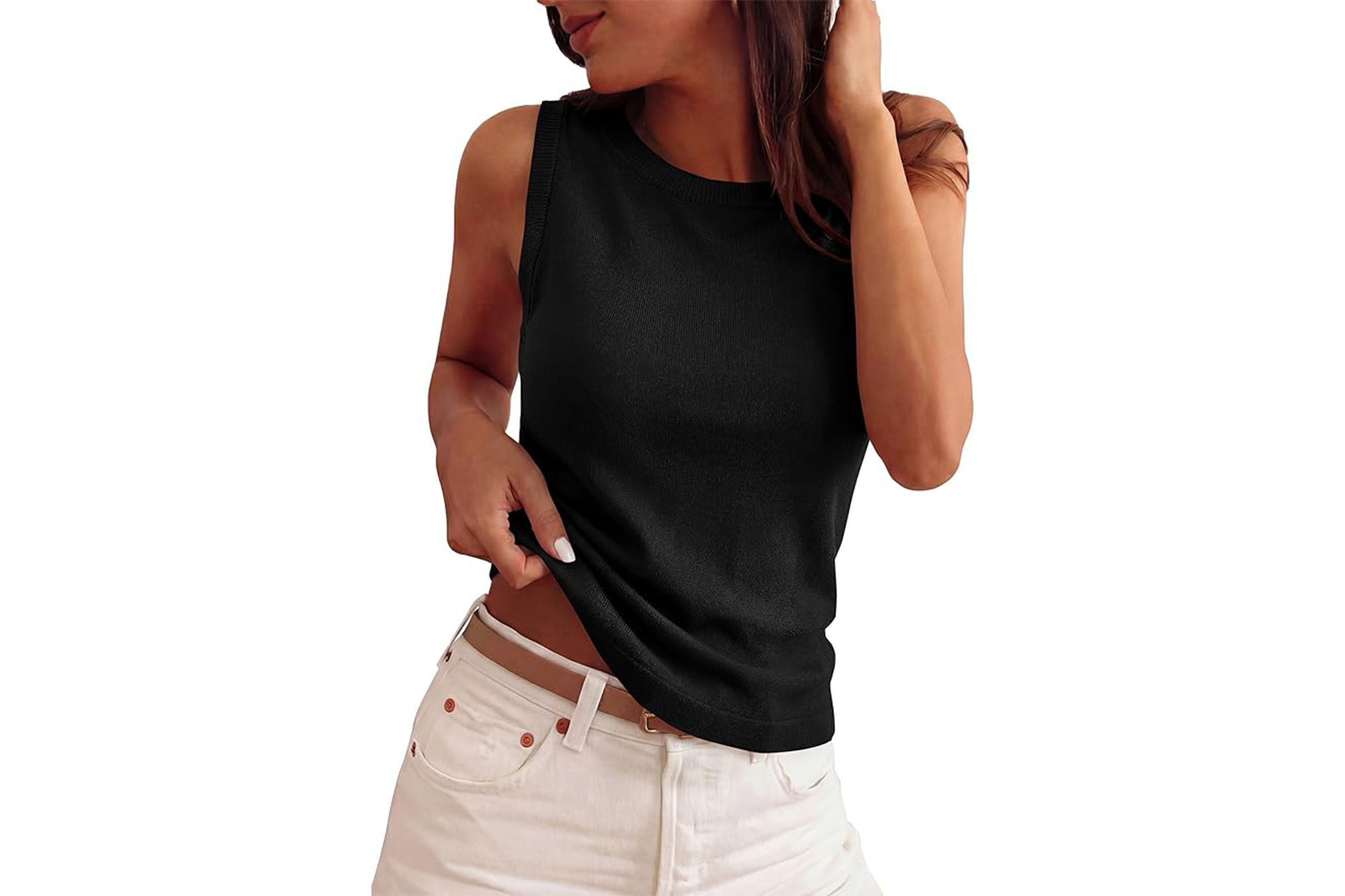 A woman wearing a black sleeveless top and white shorts, pulling up the bottom of her top with her left hand.