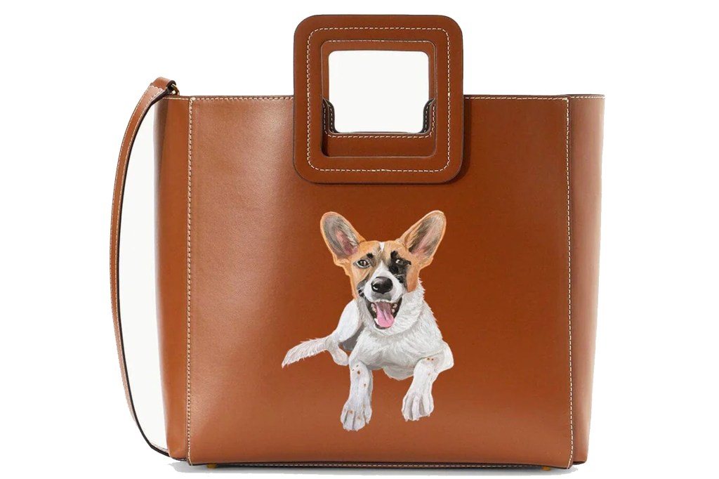 Brown leather handbag with a painted illustration of a happy dog.