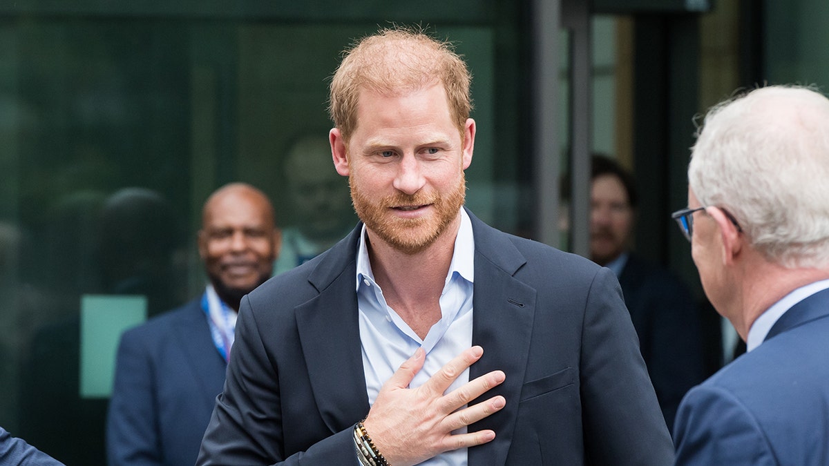 Prince Harry walking outside the Royal British Legion Centre for Blast Injury Studies in London