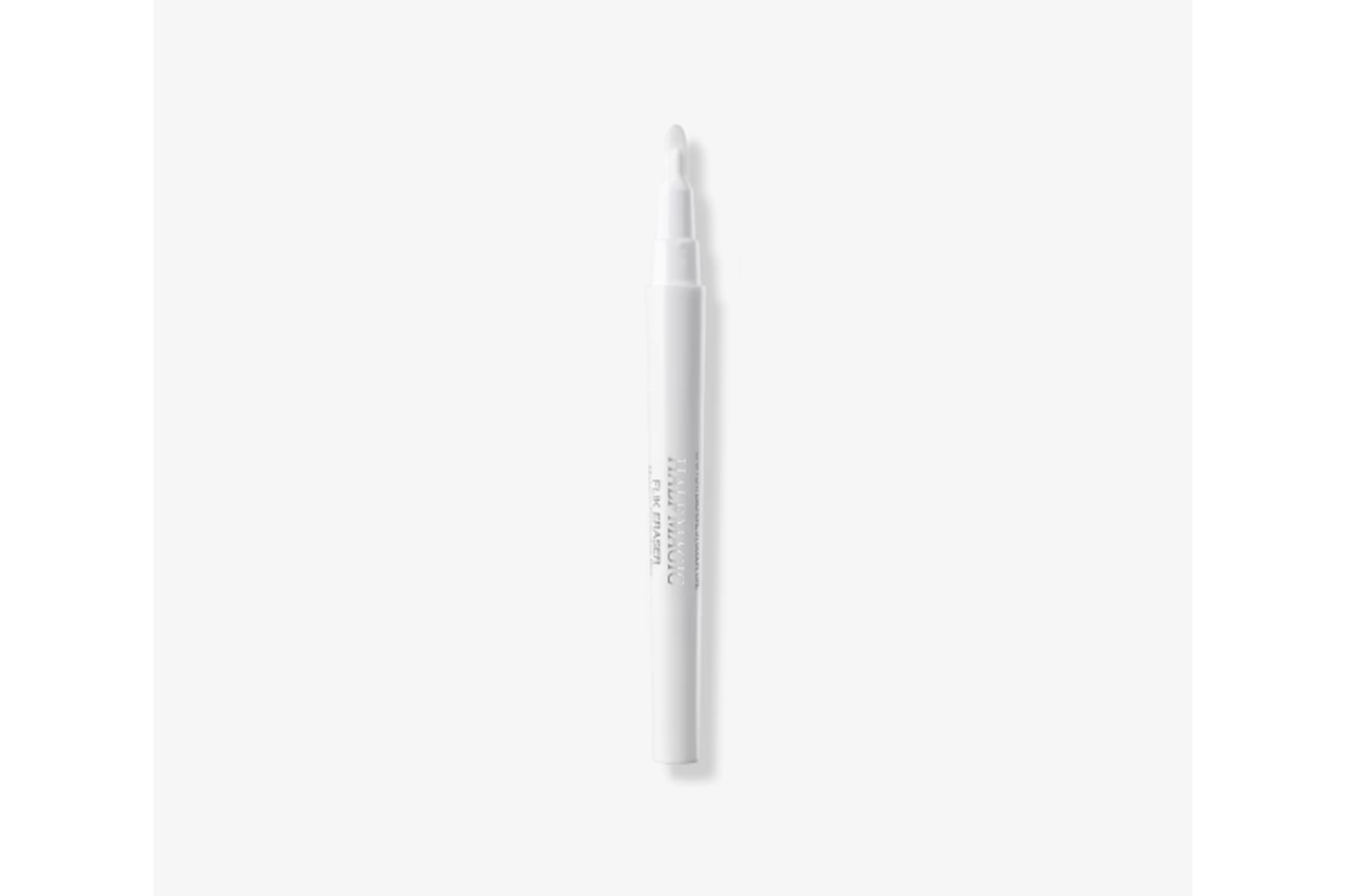 A white Wing Eraser Tool with a soft tip, used for precise makeup correction.