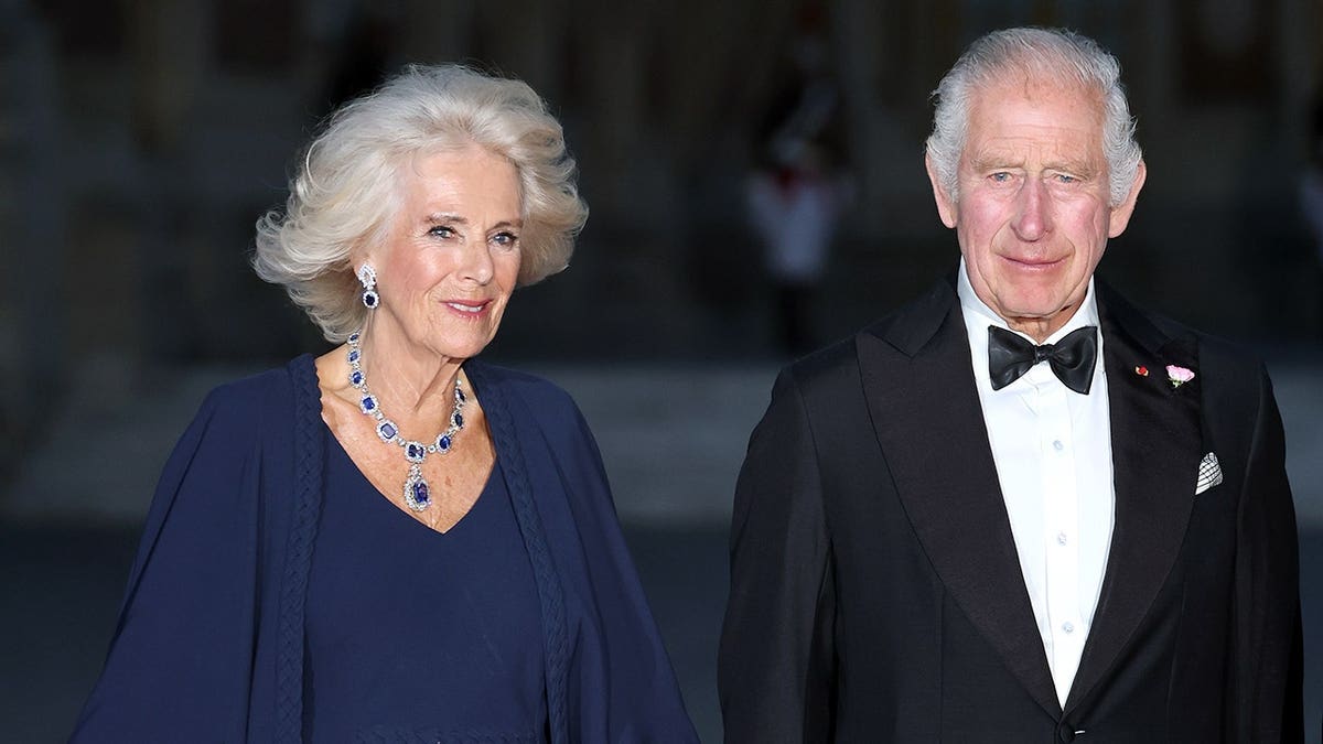 King Charles III and Queen Camilla attending a state banquet at the Palace of Versailles.