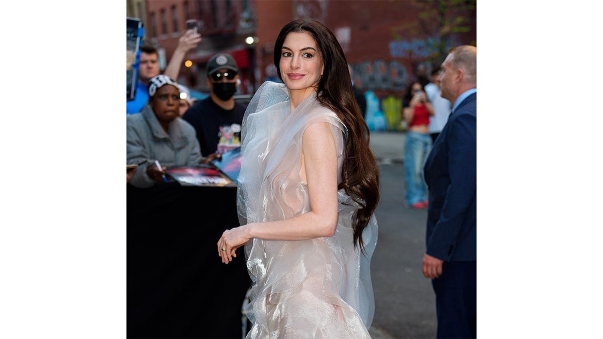 Anne Hathaway arrives at a premiere