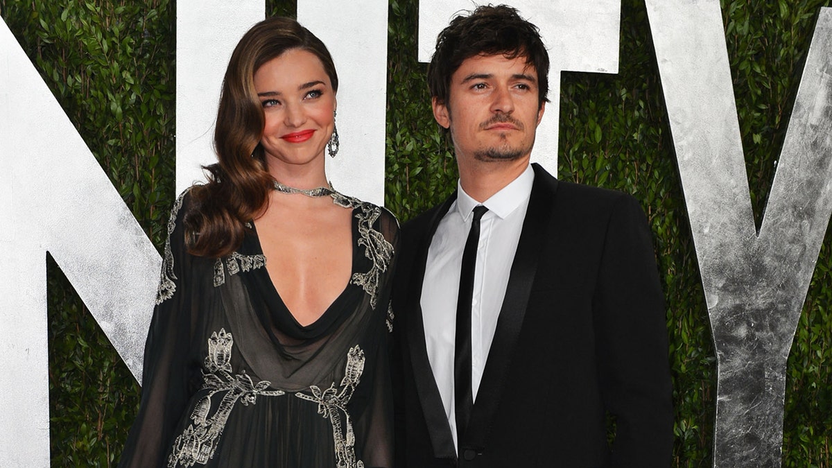 Model Miranda Kerr and actor Orlando Bloom arriving at Vanity Fair Oscar Party in West Hollywood