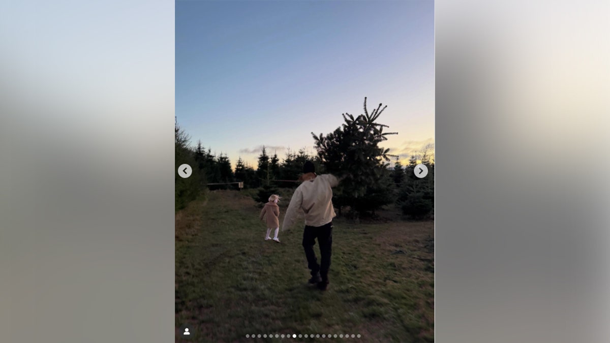 Orlando Bloom and daughter Daisy playing in a field outside