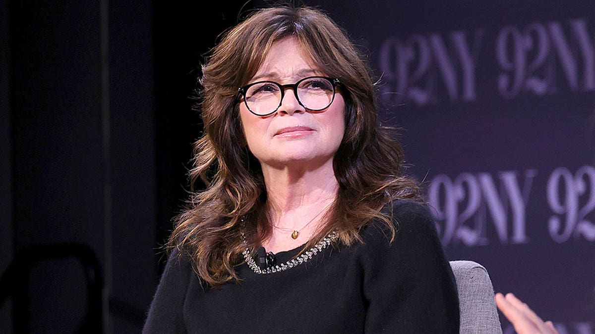 Valerie Bertinelli frowning onstage during conversation with Drew Barrymore at 92NY