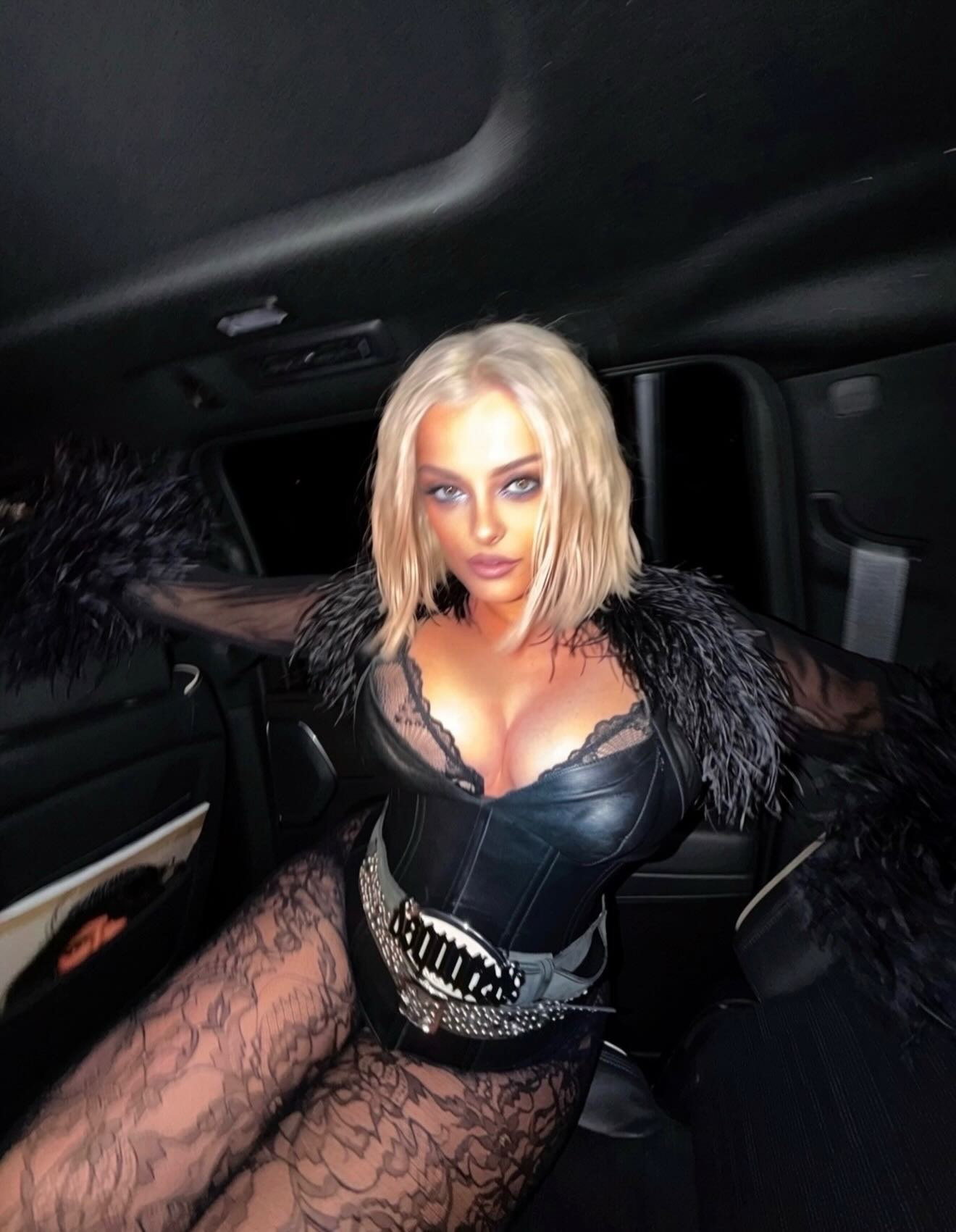 Bebe Rexha "feels so free" while lounging in the backseat of a car.