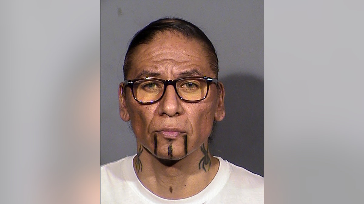 Nathan Chasing Horse facing camera in booking photo