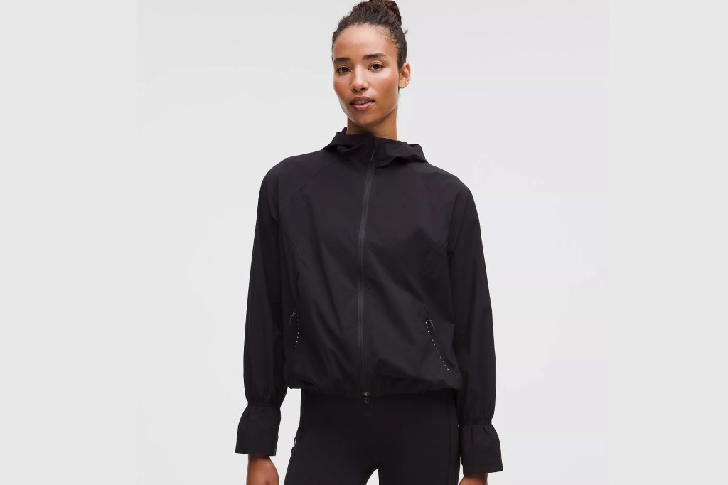 Woman in black lululemon  jacket and pants.