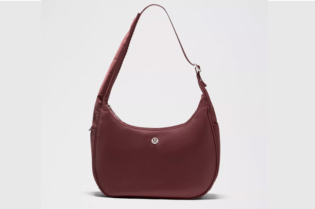 Maroon shoulder bag with a silver Lululemon logo.