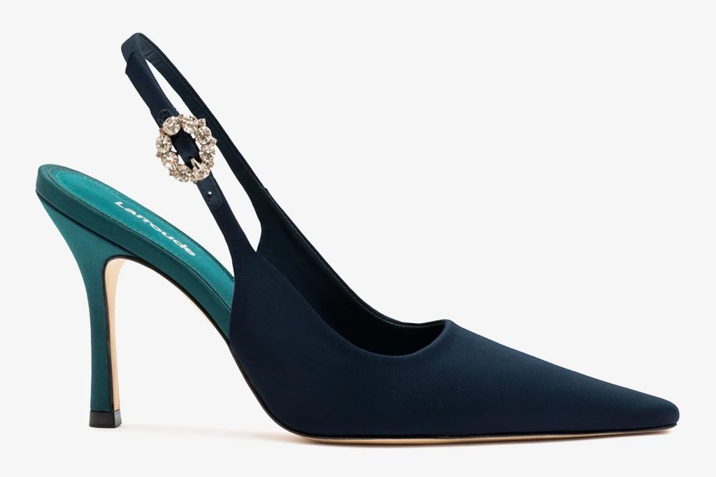 Navy blue slingback pump with a teal heel and interior, featuring a round jeweled buckle.