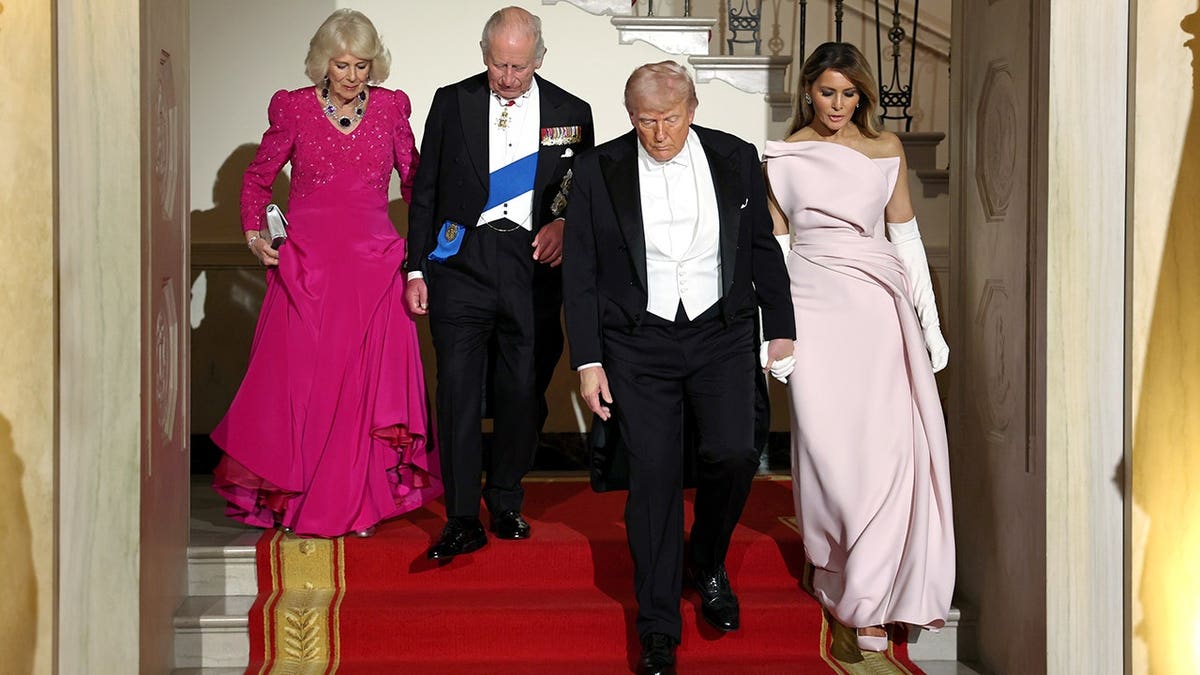 King Charles III, Queen Camilla, President Donald Trump, and First Lady Melania Trump descending the Grand Staircase at the White House
