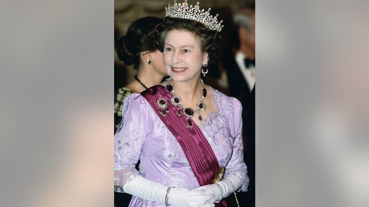 Queen Elizabeth II wearing amethyst necklace and brooch in Portugal