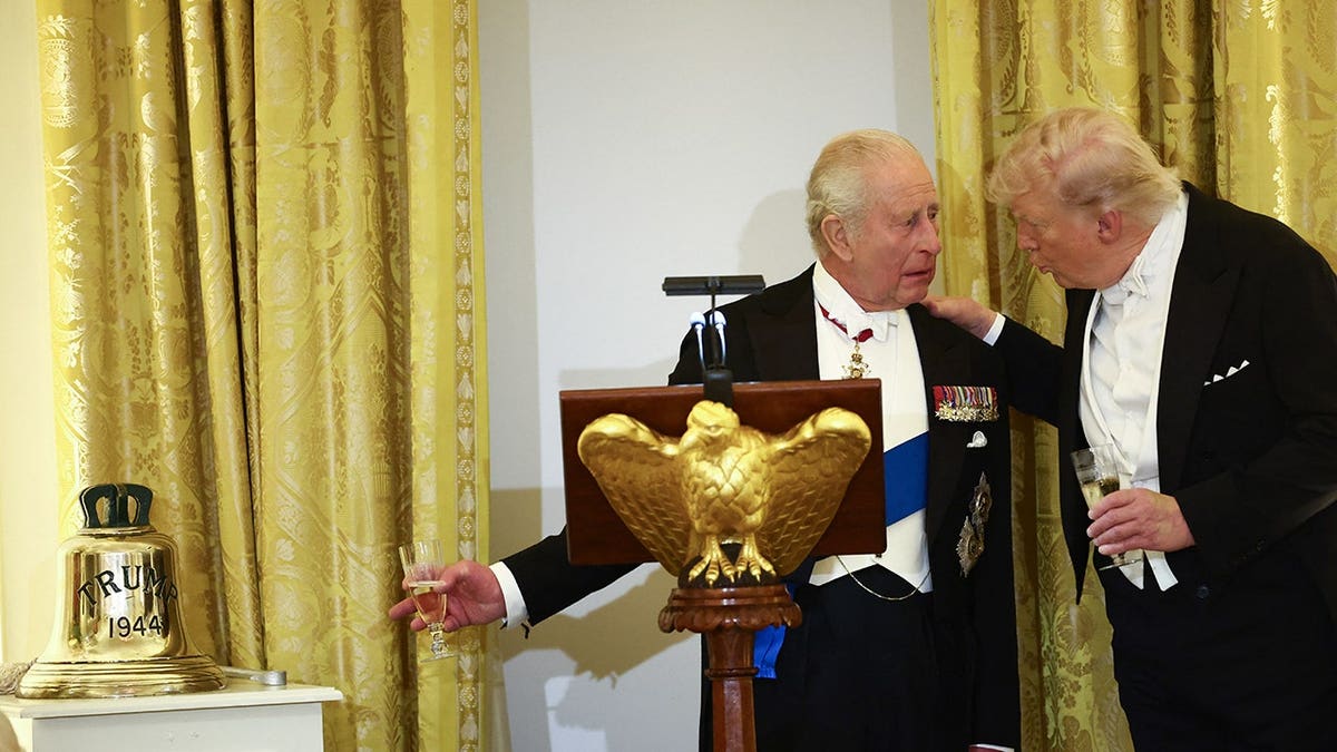 US President Donald Trump and Britain's King Charles III raising a toast in the White House East Room