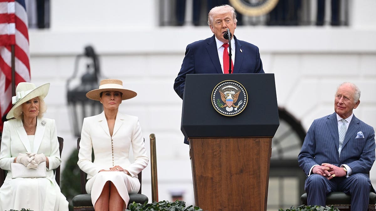 Queen Camilla King Charles III and First Lady Melania Trump watch President Donald Trump speaking on stage at the White House