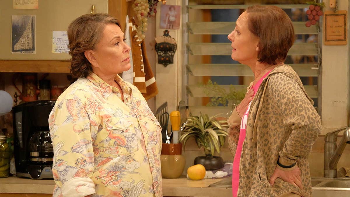 Roseanne Barr and Laurie Metcalf standing together at a promotional event