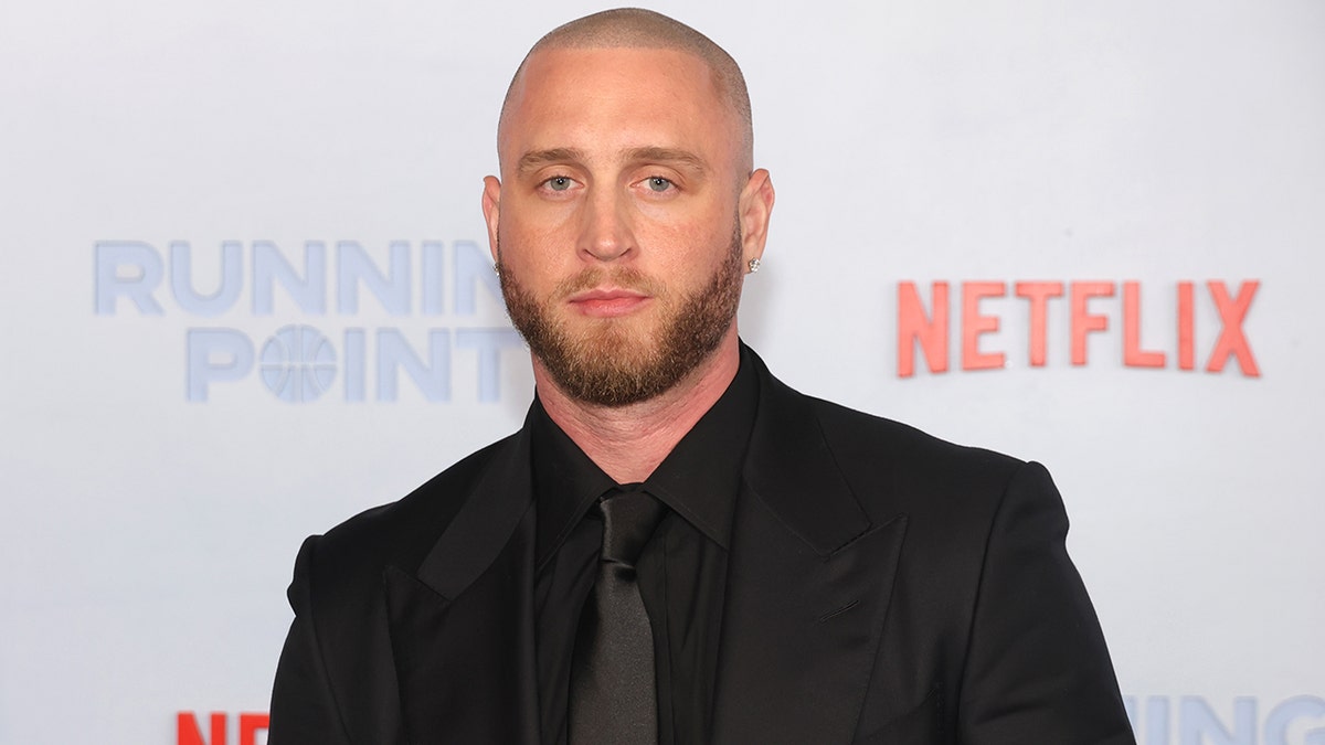 Chet Hanks standing on the red carpet at the premiere of Netflix's Running Point in Los Angeles