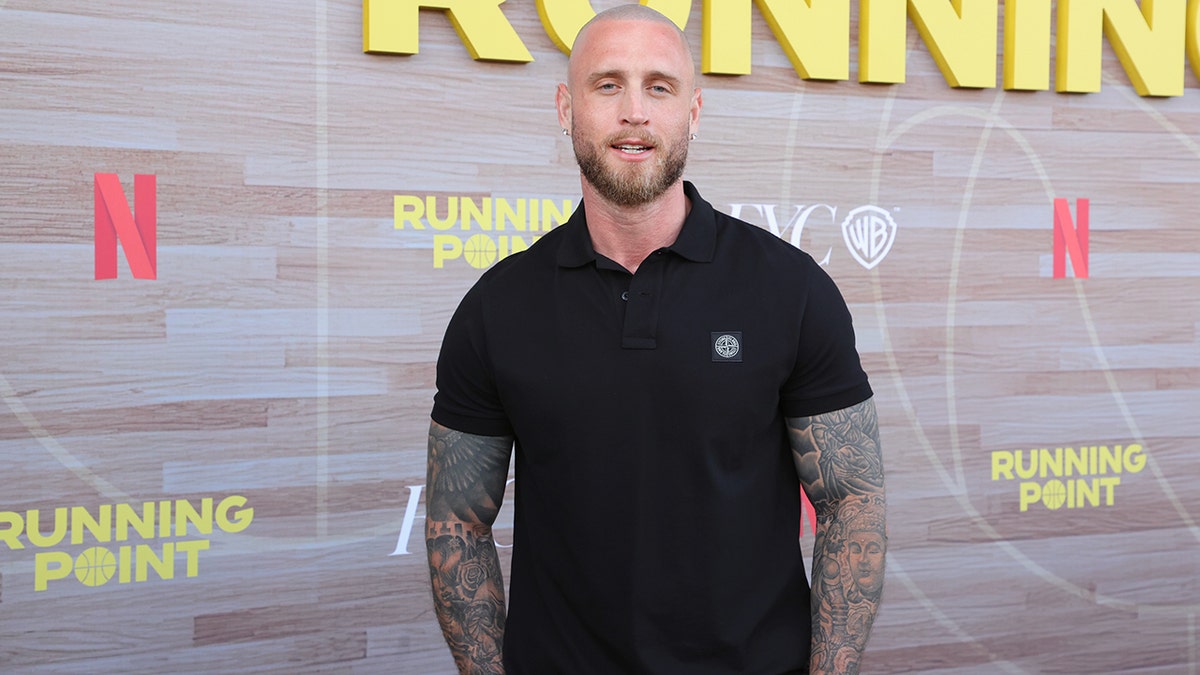 Chet Hanks standing on the red carpet at the Los Angeles Emmy FYC event