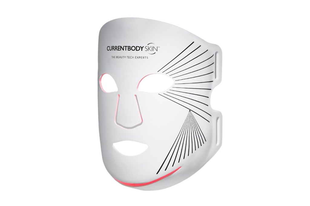 White face mask with "CURRENTBODY SKIN" logo and red glowing light on chin.