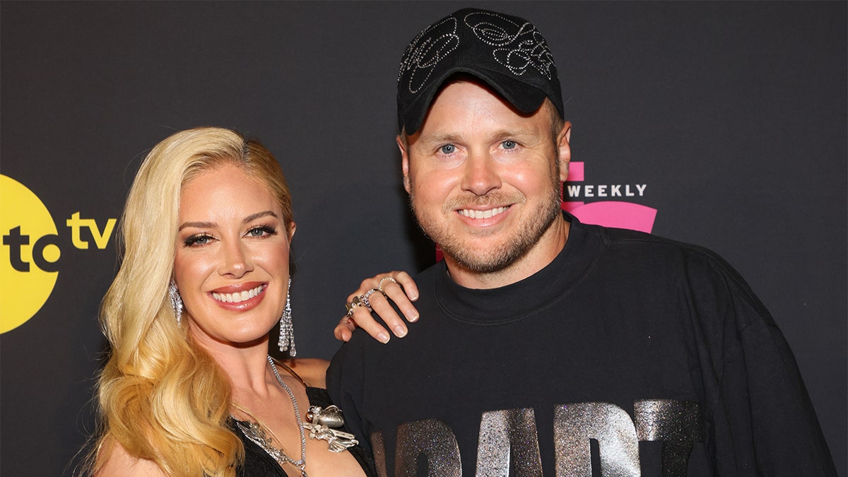 Spencer Pratt and Heidi Montag standing together outdoors