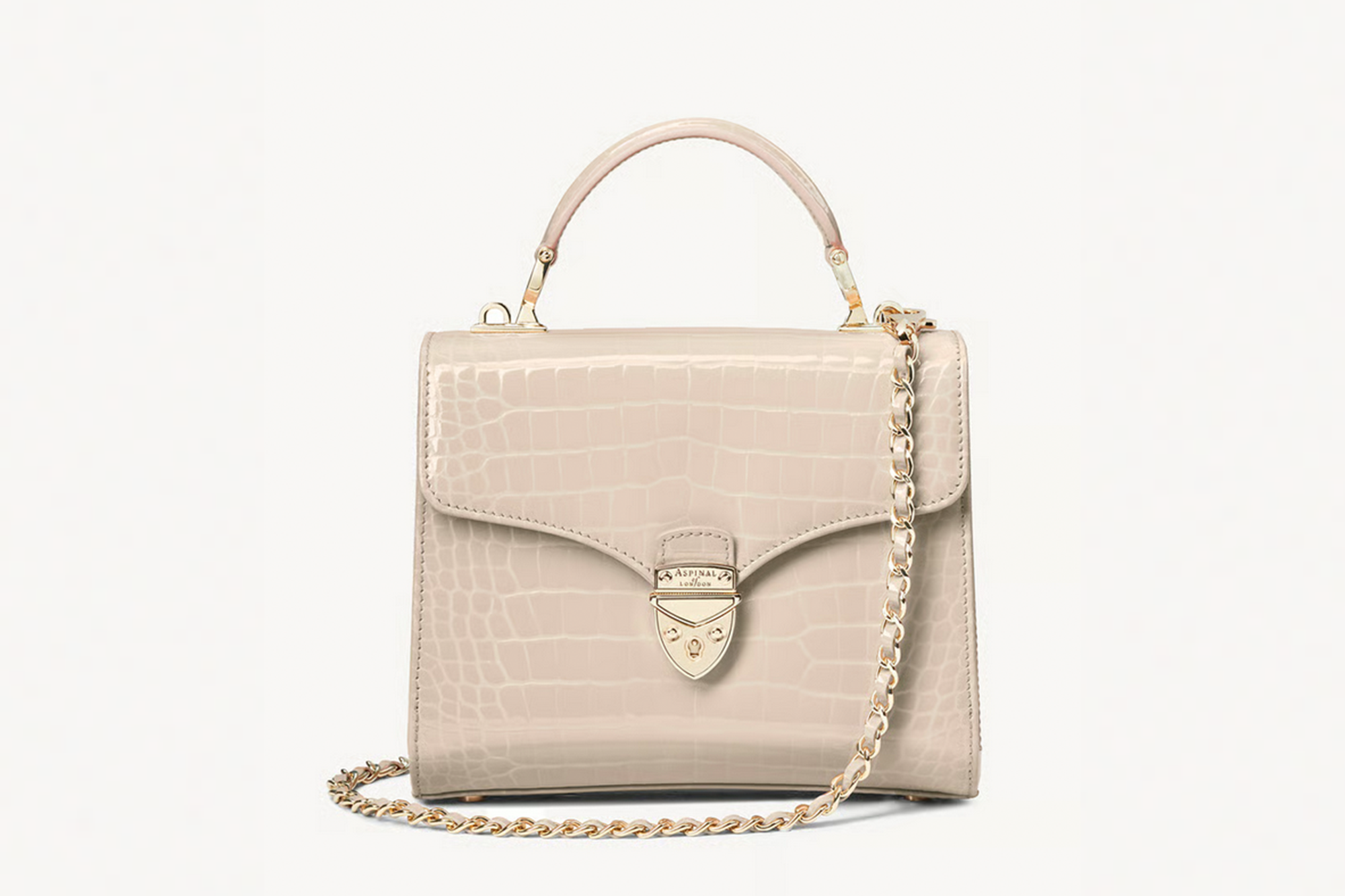 Light beige crocodile-embossed handbag with a gold clasp and chain strap.