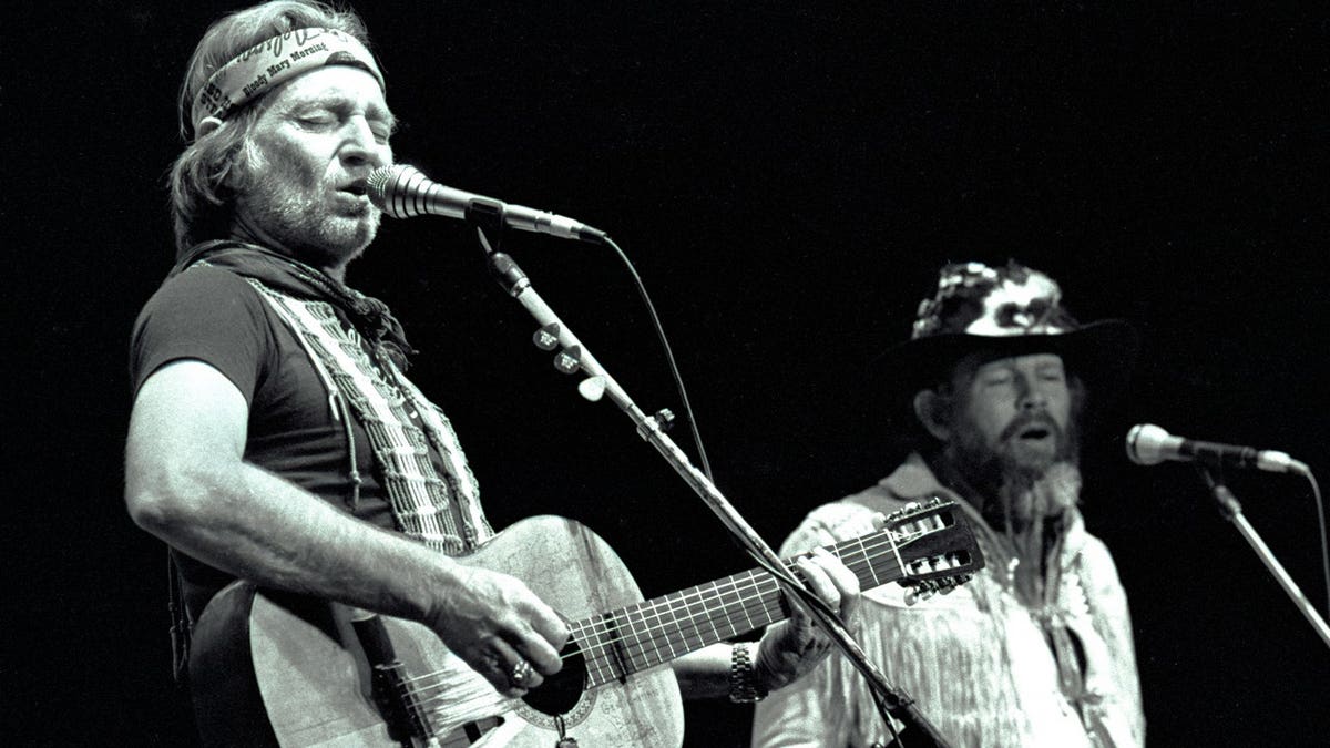 David Allan Coe and Willie Nelson perform on stage