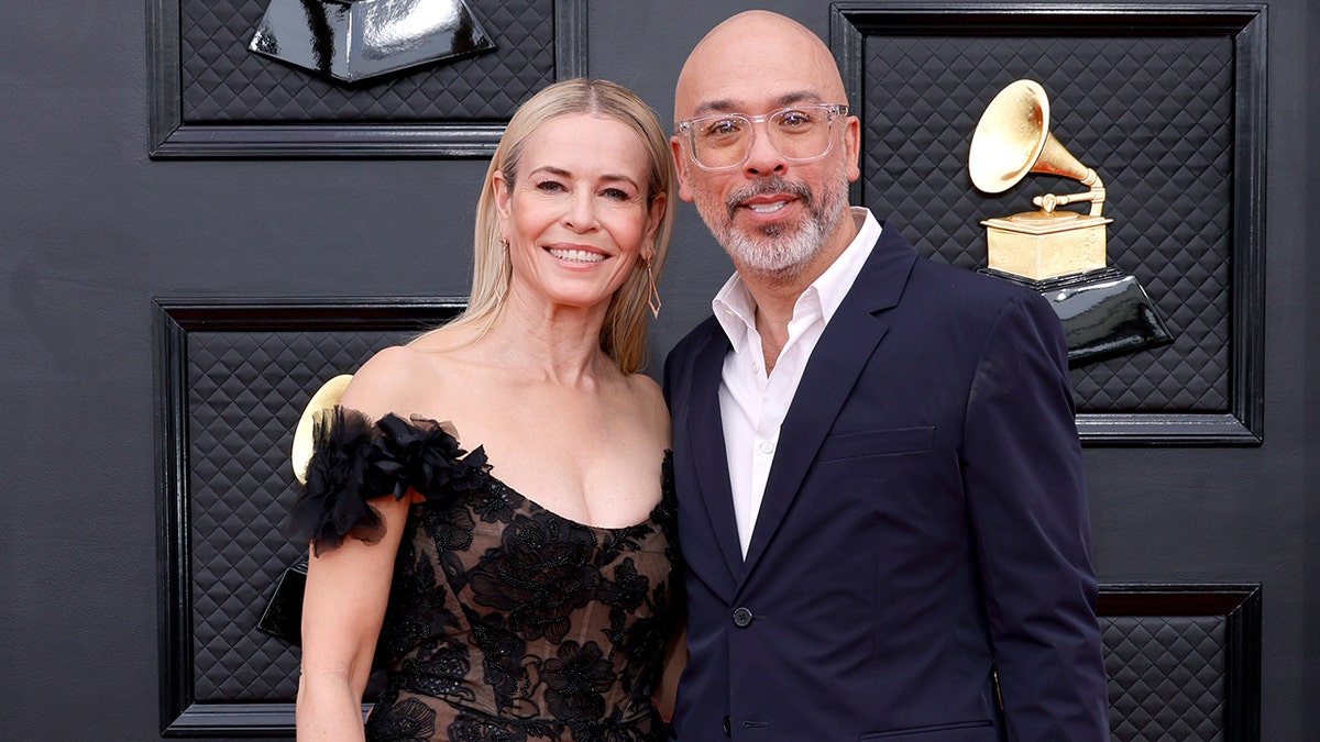 Chelsea Handler and Jo Koy standing together at the 64th Annual Grammy Awards in Las Vegas