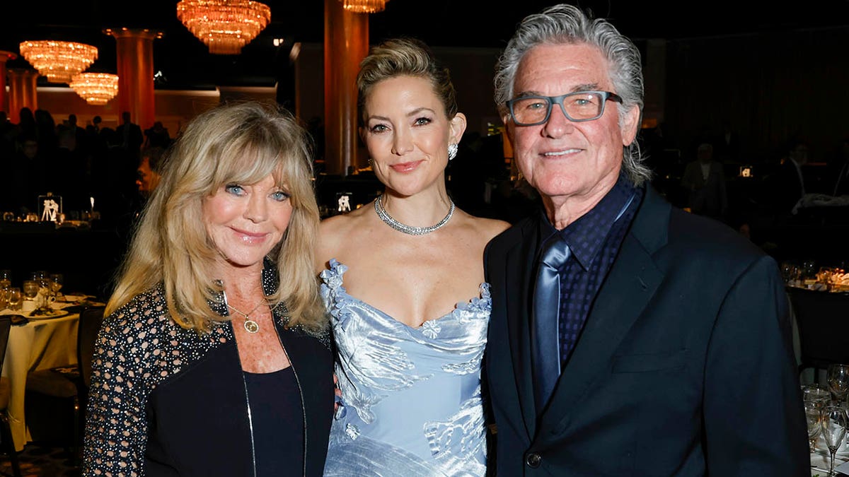 Goldie Hawn, Kate Hudson and Kurt Russell smiling at an event in Beverly Hills